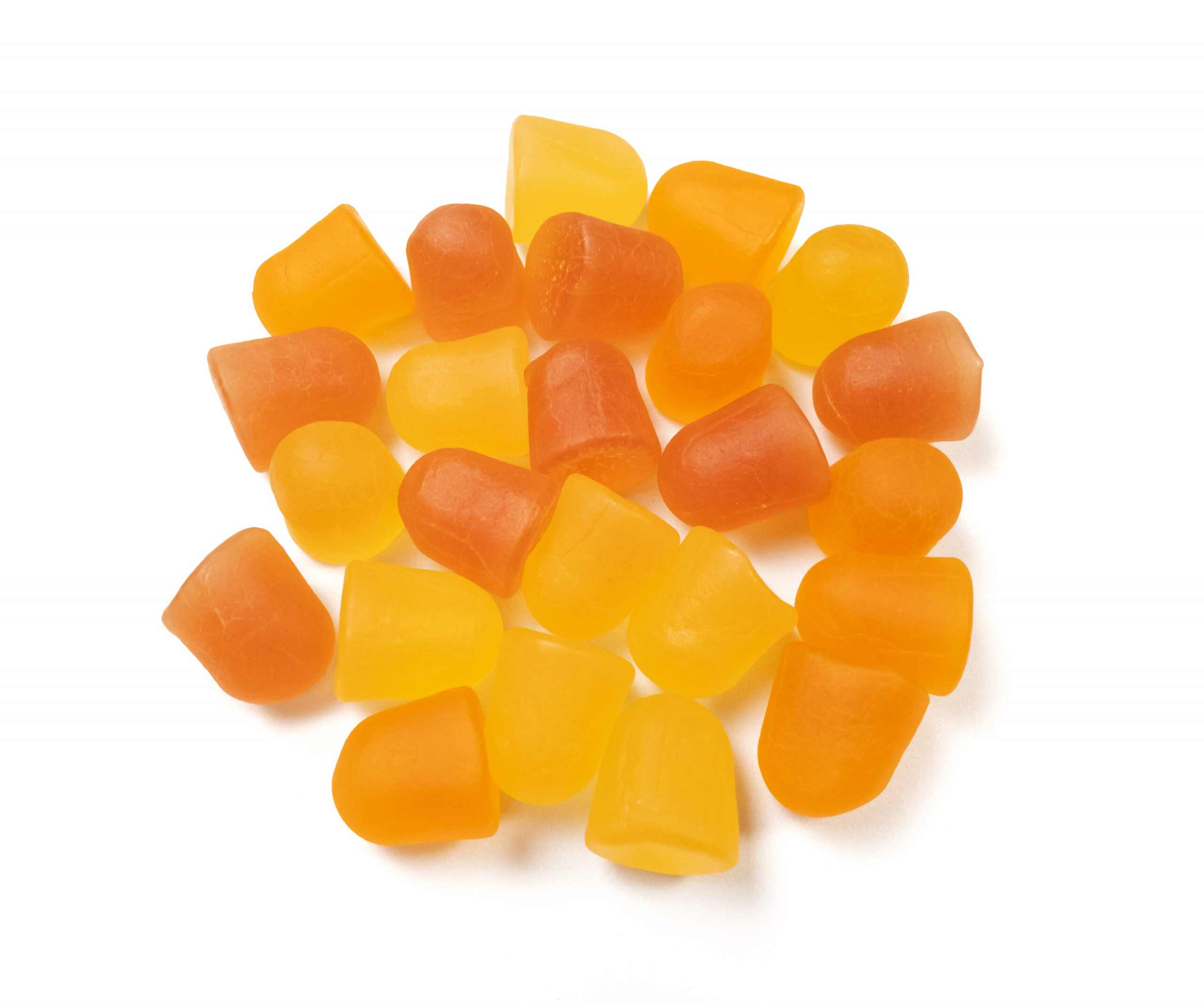 Group of orange and yellow multivitamin gummies isolated on white background. Healthy lifestyle concept.