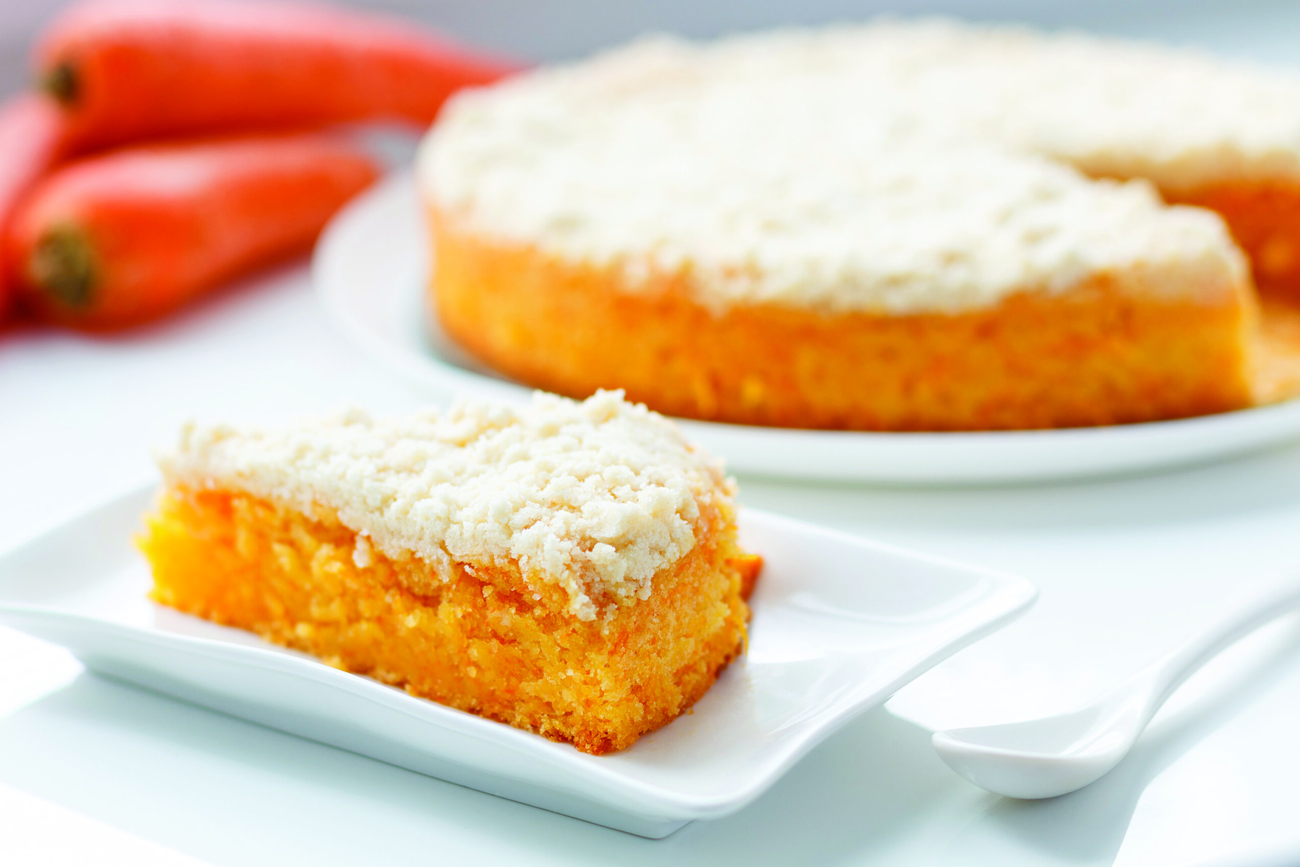 Slice of vegan carrot cake with crispy crumb