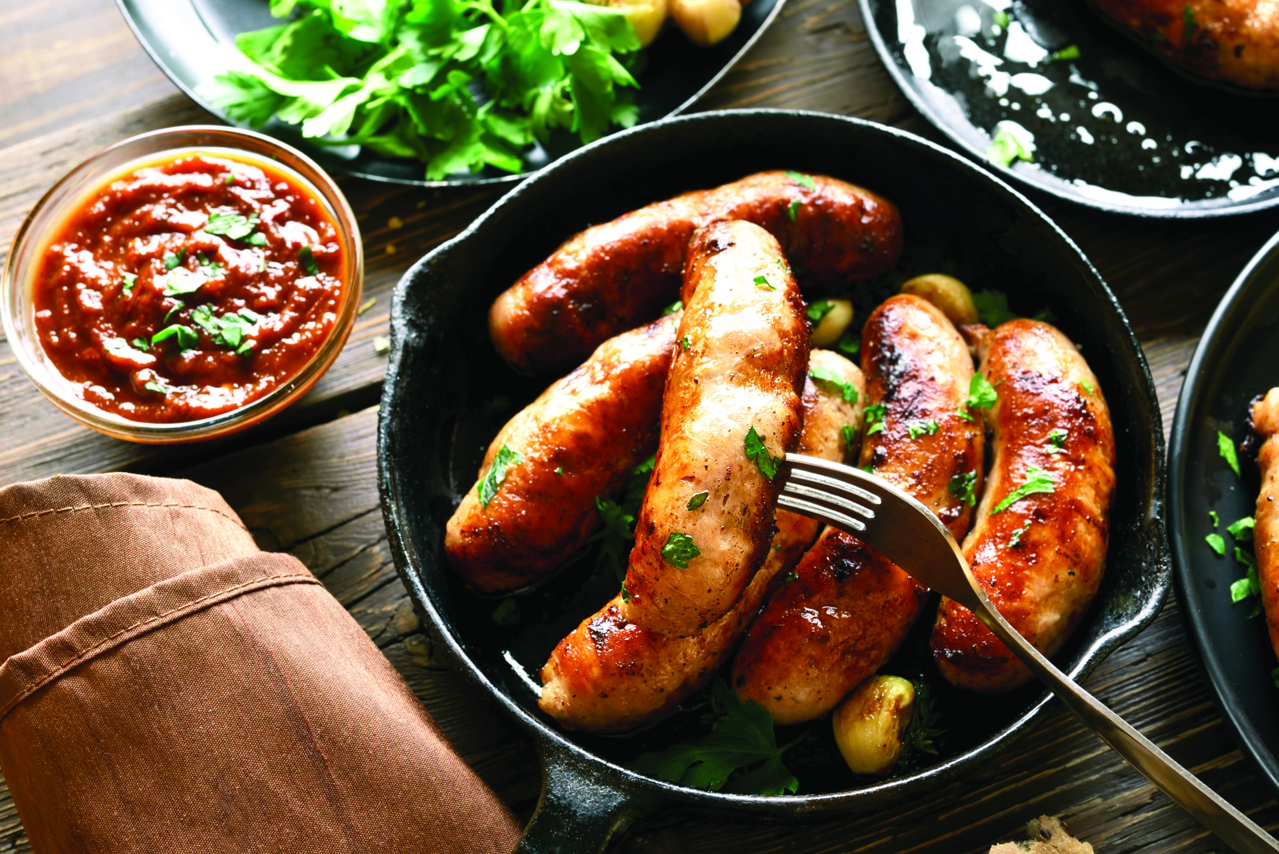 Fried sausages in frying pan