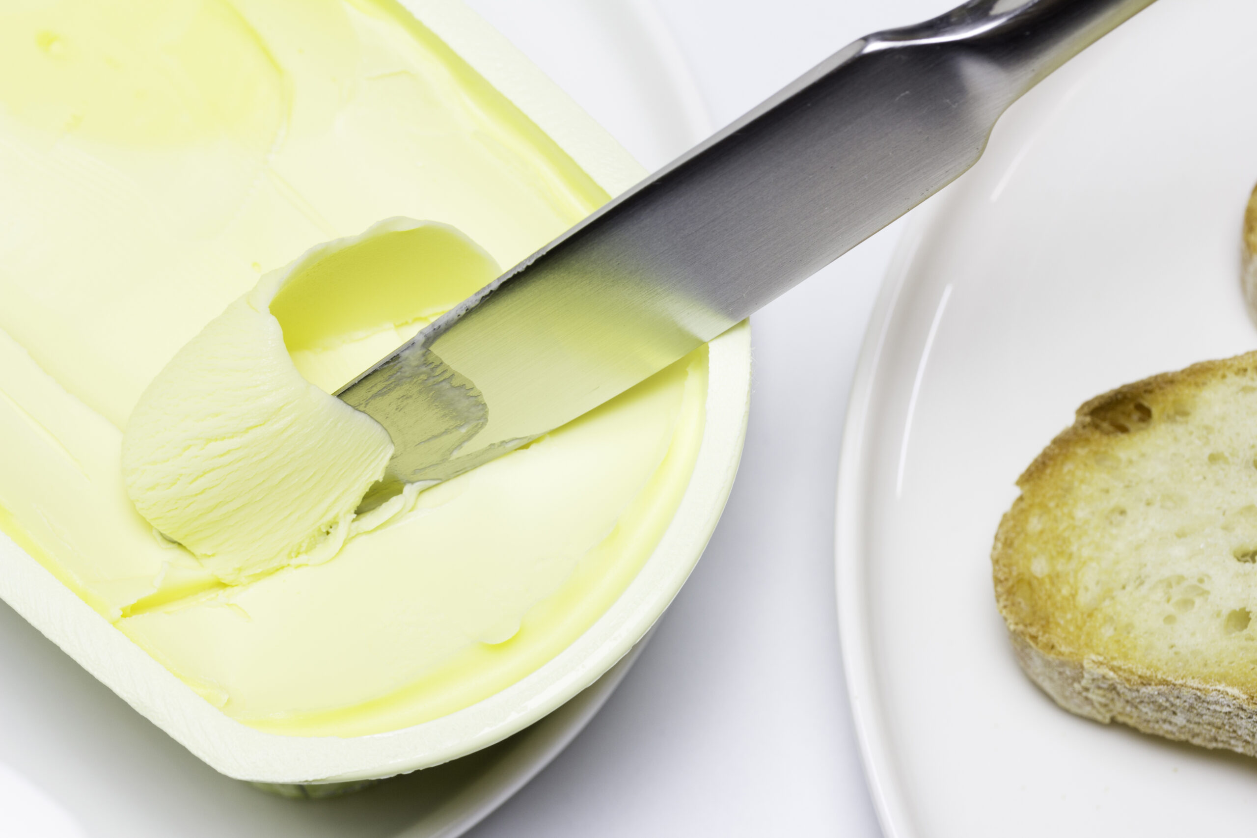 Artisan bread toast with butter on white background