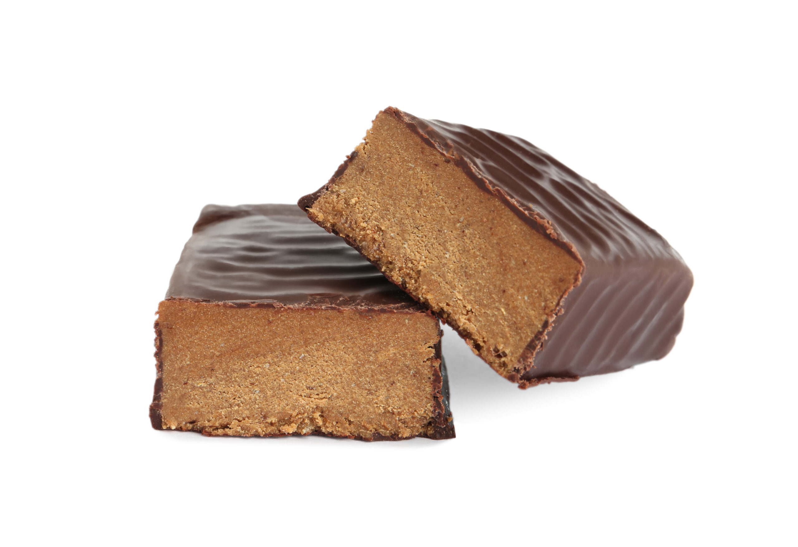 Halves of tasty chocolate glazed protein bar on white background