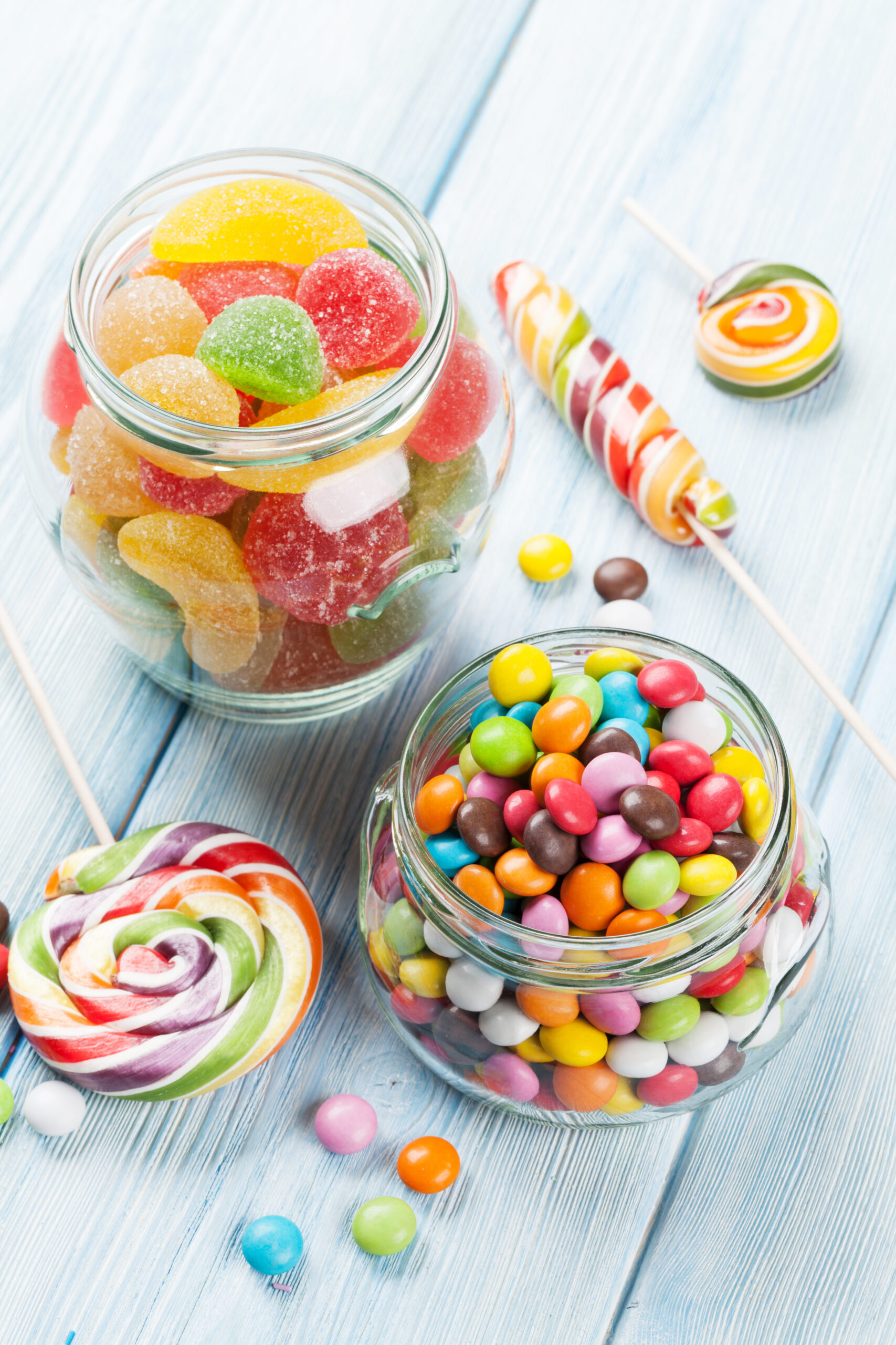 Colorful candies on wooden table