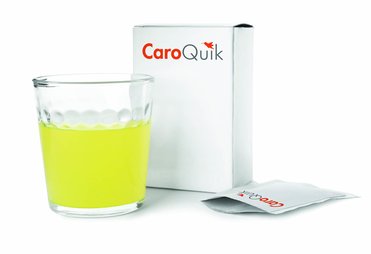 Box, sachet and glass of dissolved medicine on white background